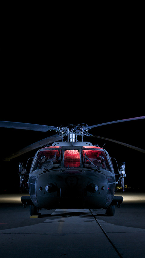 A uh60 black hawk helicopter lit up by multiple external screenshot