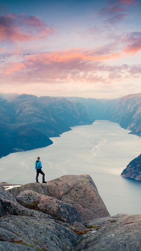Man Standing on The Cliff Looking at The River Below screenshot