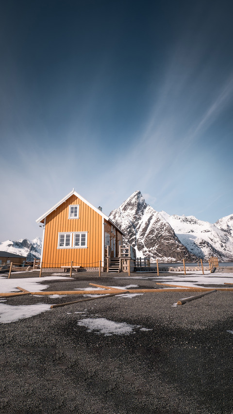 Famous yellow cabin with olstind mountain in lofoten screenshot