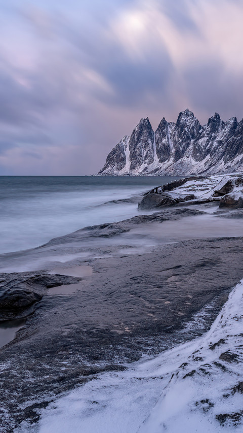 The snowcapped mountain coast of senia island screenshot