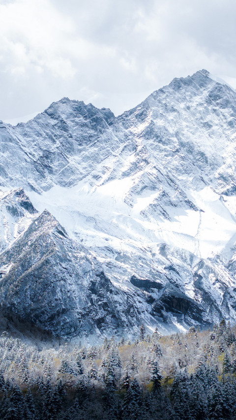 The snow-capped peaks rise high screenshot
