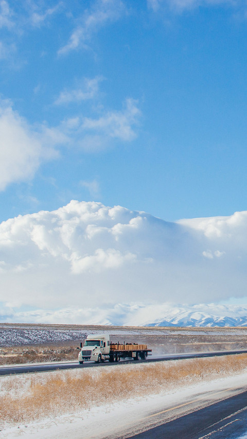 Highway in the middle of the mountains in a snowy winter screenshot