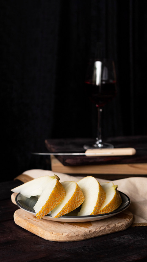 Pieces of melon on wooden boards with a knife screenshot