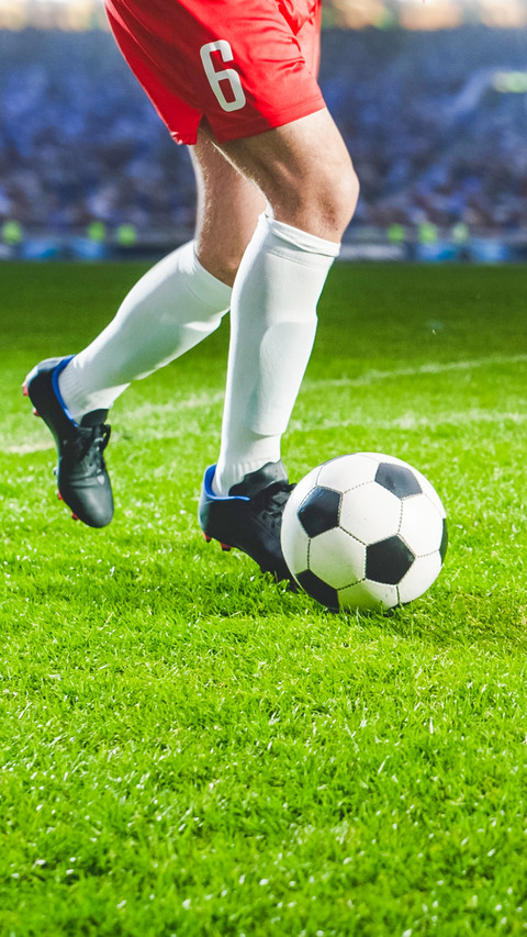 Close-Up On Legs Of Professional Football Player screenshot