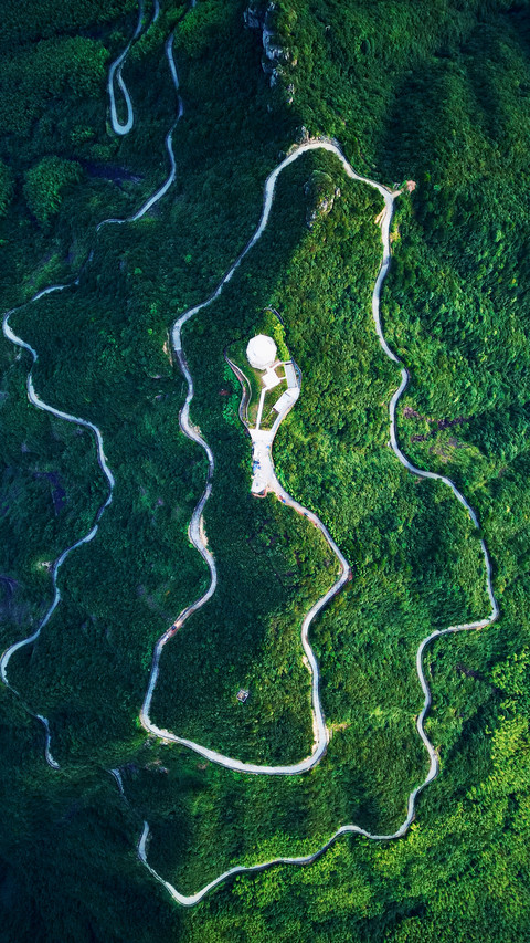 Aerial photography of winding mountain roads screenshot