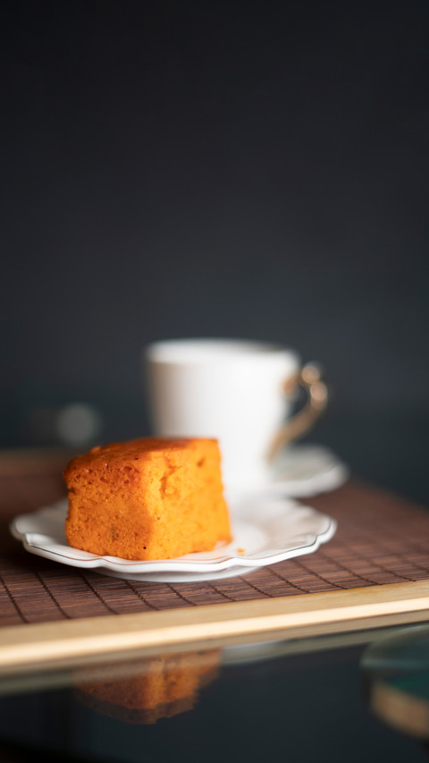 Coffee and orange cake on a black background screenshot