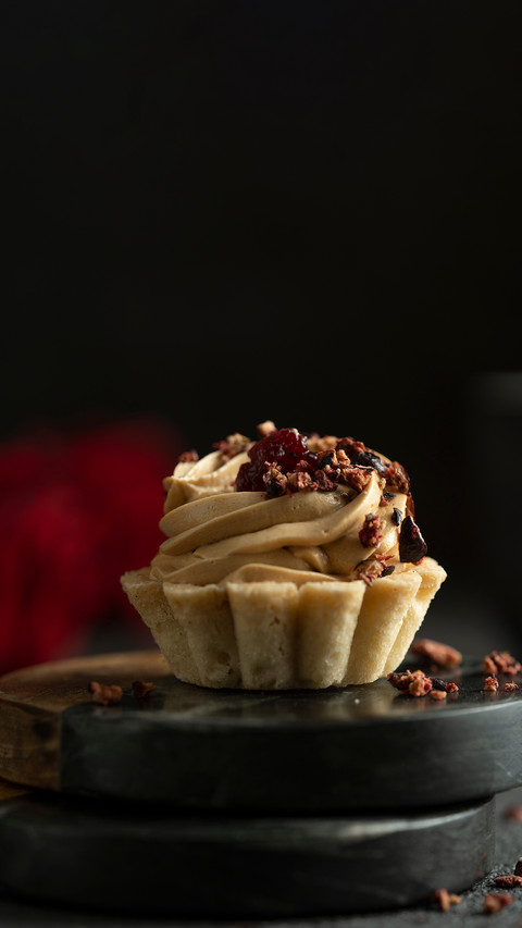 Little with cream, red roses on black table screenshot