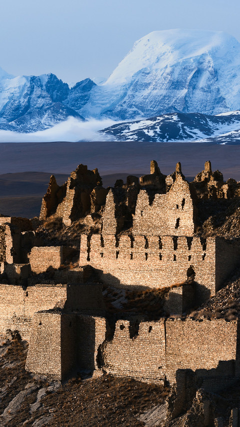 Abandoned Castle And Snowy Mountains in The Distance screenshot