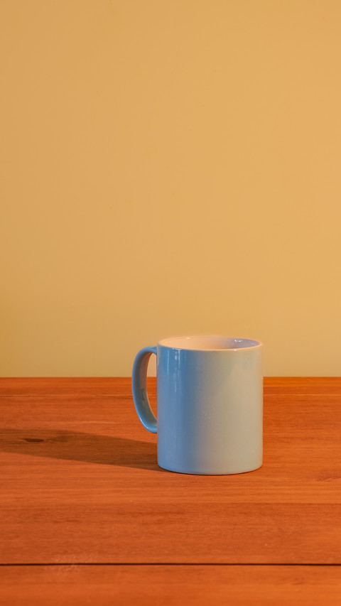 Blue mug on an empty wooden table screenshot