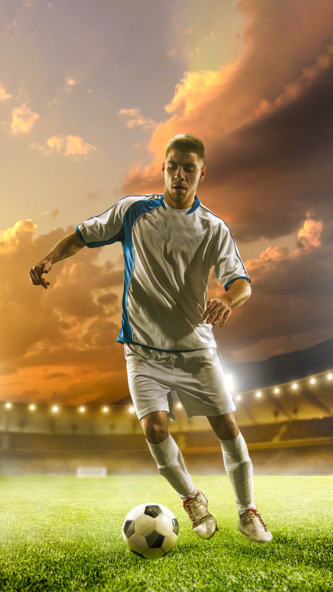 Soccer player in action on sunset stadium background screenshot