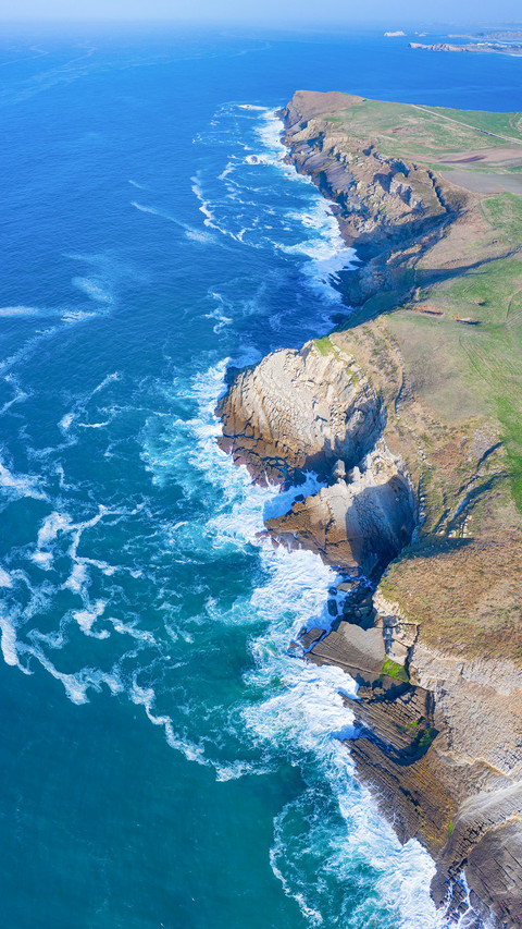 Aerial coastal view around Tagle Beach screenshot