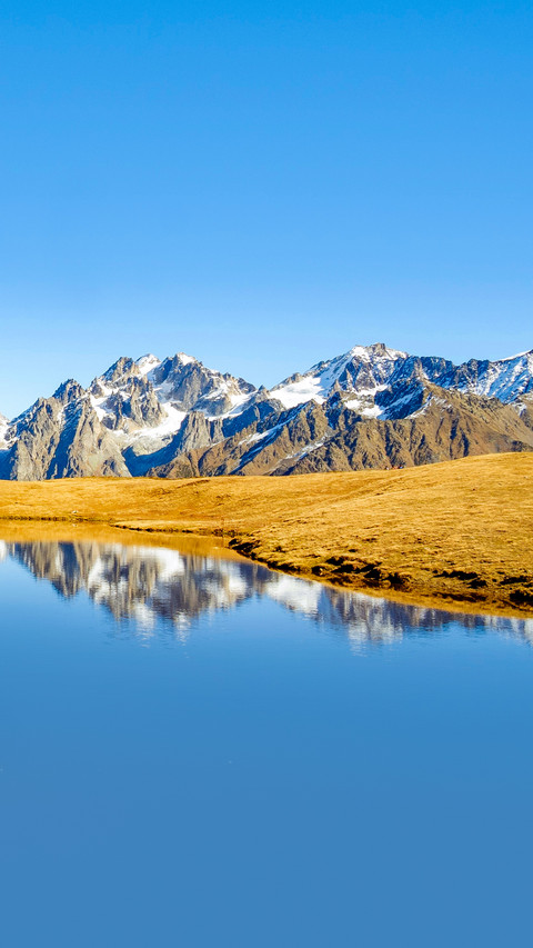 Beautiful reflection in Koruldi lake, Caucasus foothills screenshot