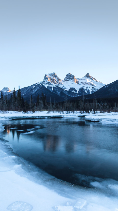 View of Three Sisters from Policeman's creek in Canmore screenshot